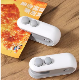 آلة ختم يدوية منزلية صغيرة محمولة لإغلاق الأكياس البلاستيكية والوجبات الخفيفة