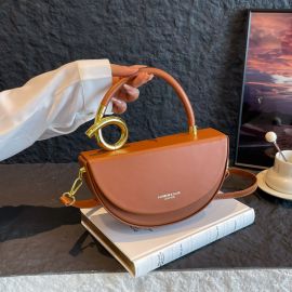 شنطه نسائي بمقبض يد ذهبي