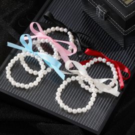  سوار مرن من اللؤلؤ الاصطناعي بفيونكة ملونة للسيدات / قطعتين