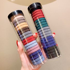 علبة من 20 ربطة مطاطية معلبة لربط الشعر بمرونة عالية ومتانة 