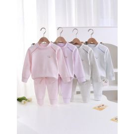 طقم بيجامة بأكمام ورقبة دائرية وبنطال طويل بألوان سادة للاطفال