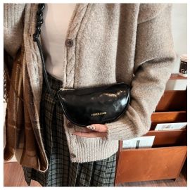 شنطه نسائي مزينه بحزام مضفر