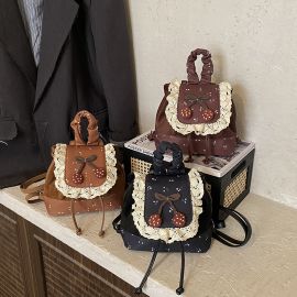 شنطة نسائي مزينه بقماش الدانتيل 