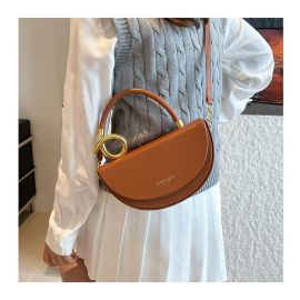 شنطه نسائي بمقبض يد ذهبي