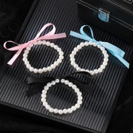  سوار مرن من اللؤلؤ الاصطناعي بفيونكة ملونة للسيدات / قطعتين