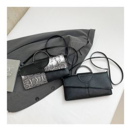 شنطة يد نسائية ذات مسكة دائرية