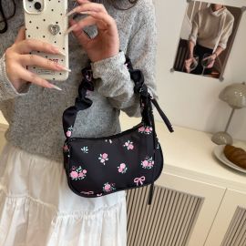 شنطة نسائي مزين برسومات ورديه