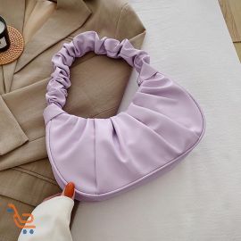 شنطه نسائي بشكل مزموم ذات تصميم عصري