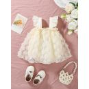 فستان منقوش بالورود مع حواف مكشكشة للمواليد 